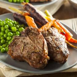 Homemade Cooked Lamb Chops with Peas and Carrots